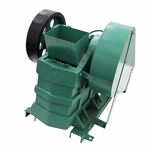 Green industrial machine with a hopper and motor