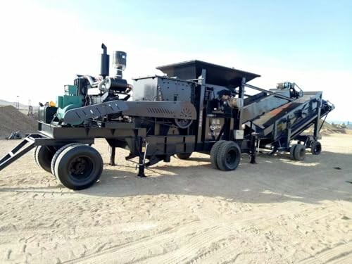 Mobile rock crusher on a construction site.